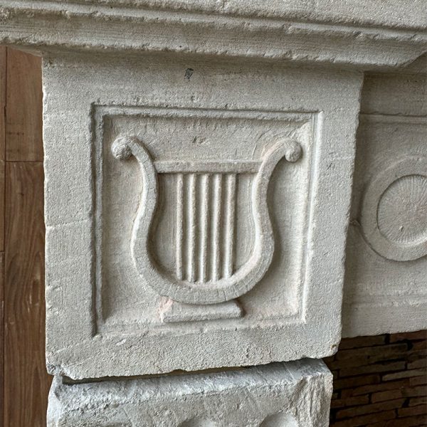 sculpted lyre mantel reclaimed stone fireplace