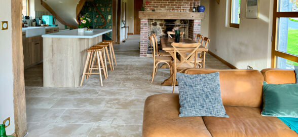 norman cottage with beige limestone flooring